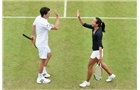 BIRMINGHAM, ENGLAND - JUNE 15:  Tim Henman and Anne Keothavong of England take part in an exhibition match to honour the late Elena Baltacha during Day Seven of the Aegon Classic at Edgbaston Priory Club on June 15, 2014 in Birmingham, England.  (Photo by Tom Dulat/Getty Images)
